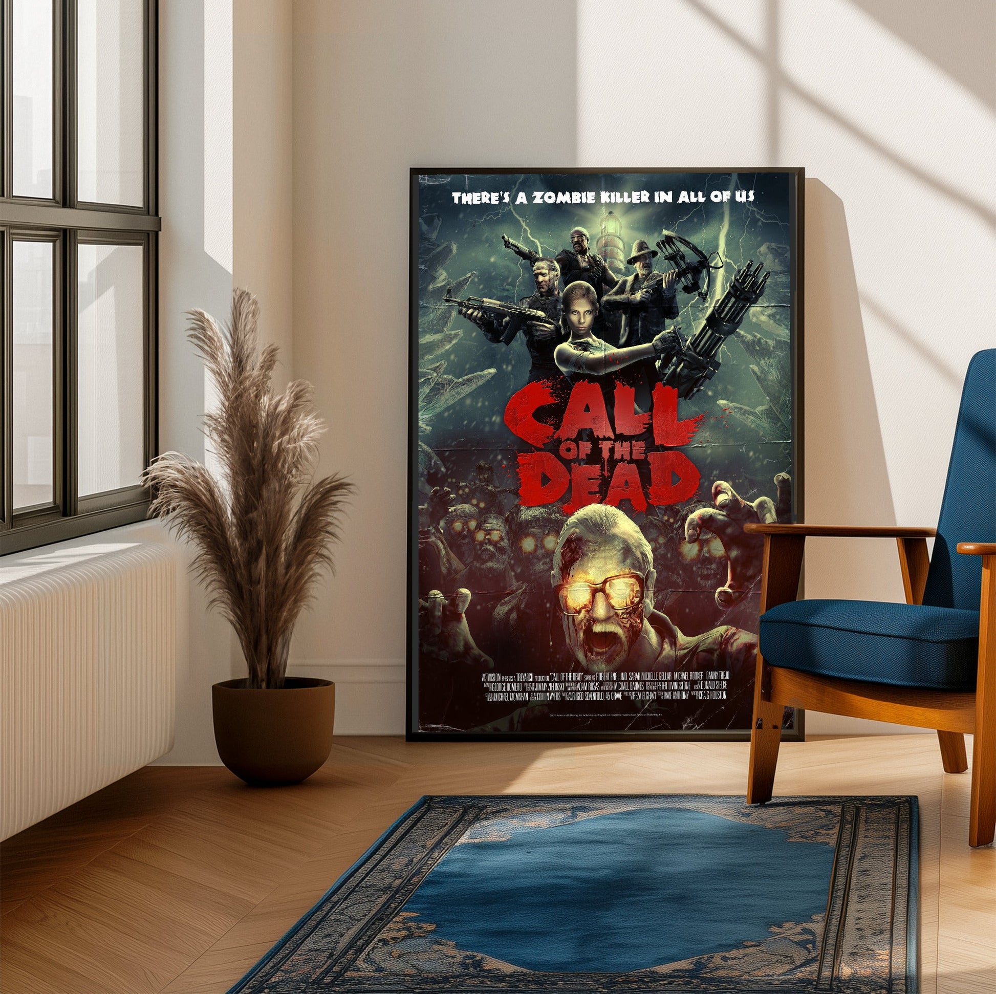 Call of Duty Black Ops Call of the Dead zombies art framed beside a blue armchair in a sunlit room