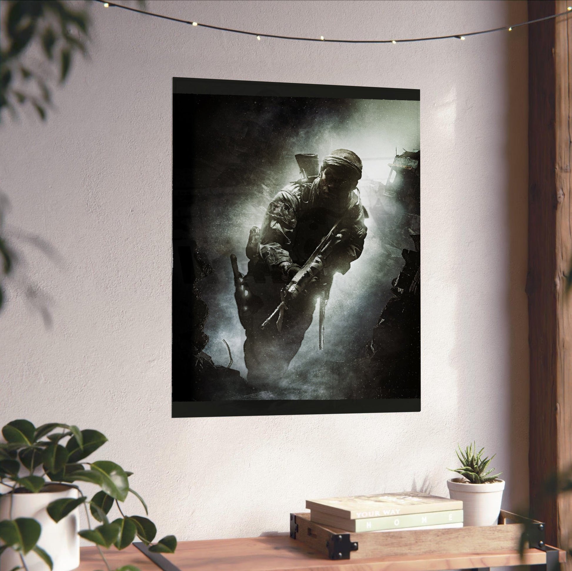 Call of Duty Black Ops key art unframed on a white wall above a desk