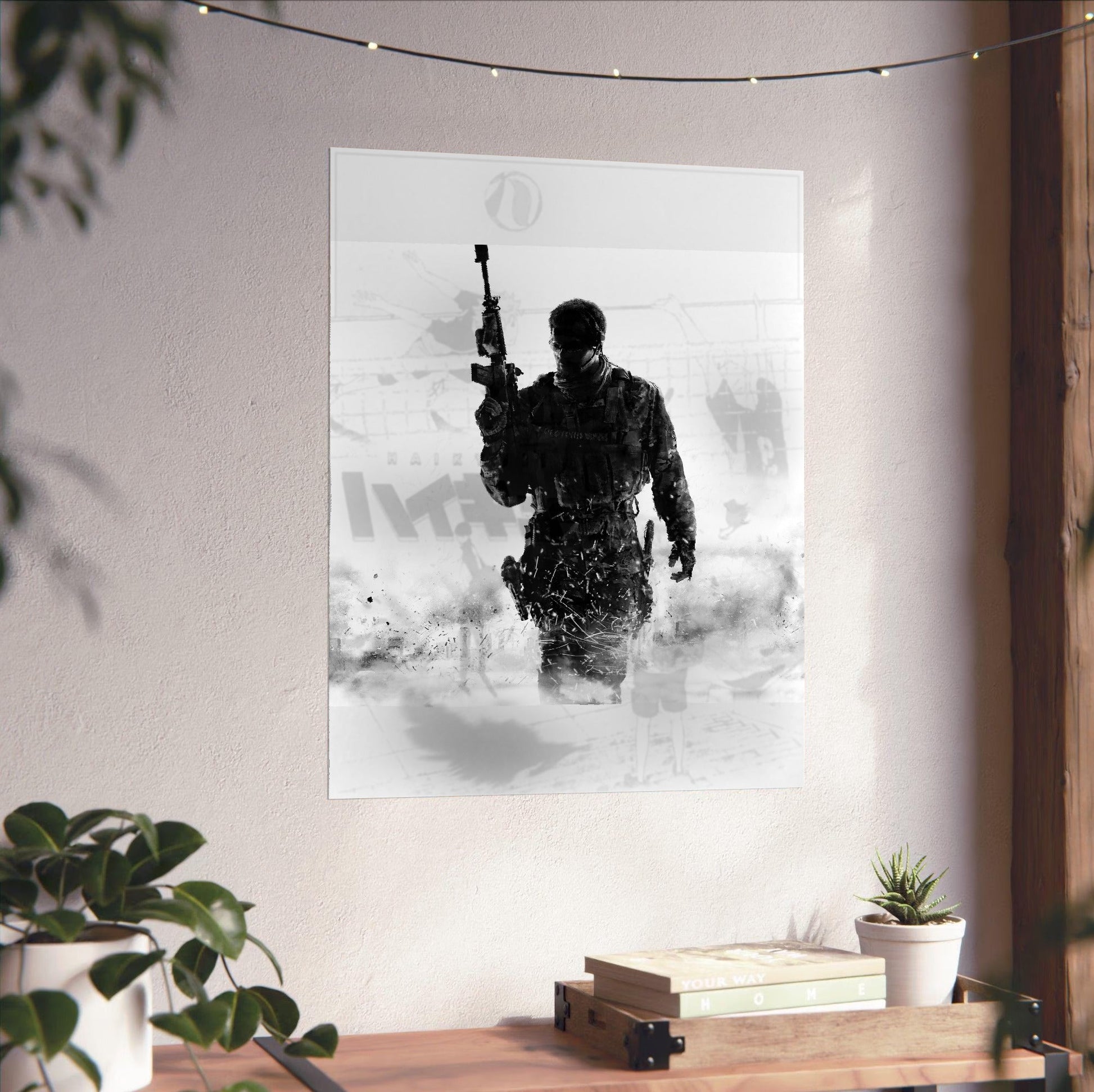 Call of Duty Modern Warfare 3 cover art unframed on a white wall above a desk