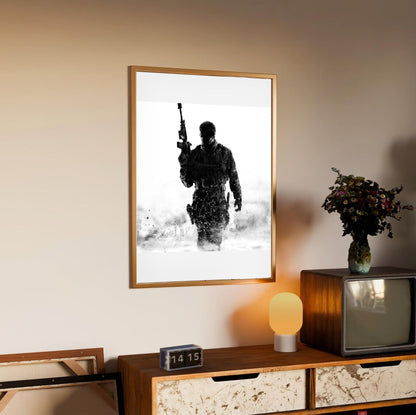 Call of Duty Modern Warfare 3 cover art in an oak frame above a sideboard