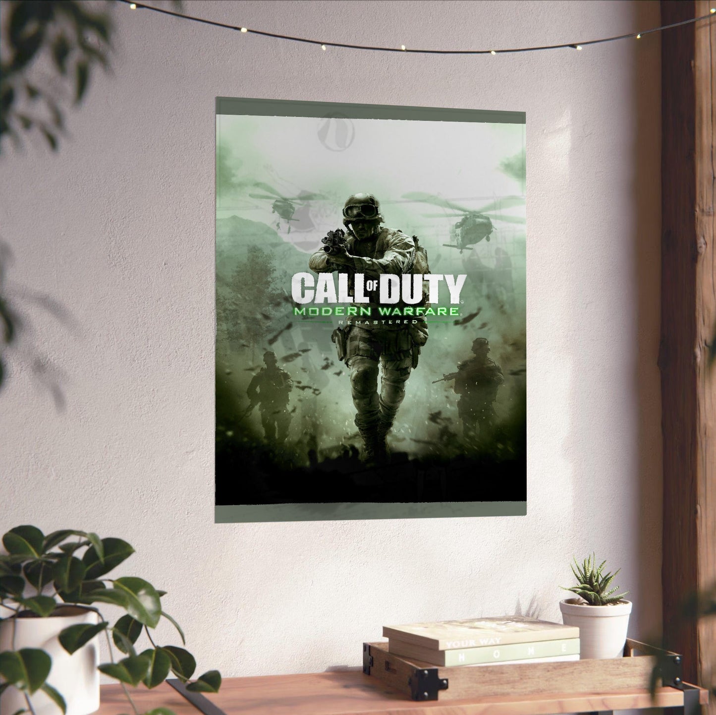 Call of Duty Modern Warfare Remastered key art unframed on a white wall above a desk