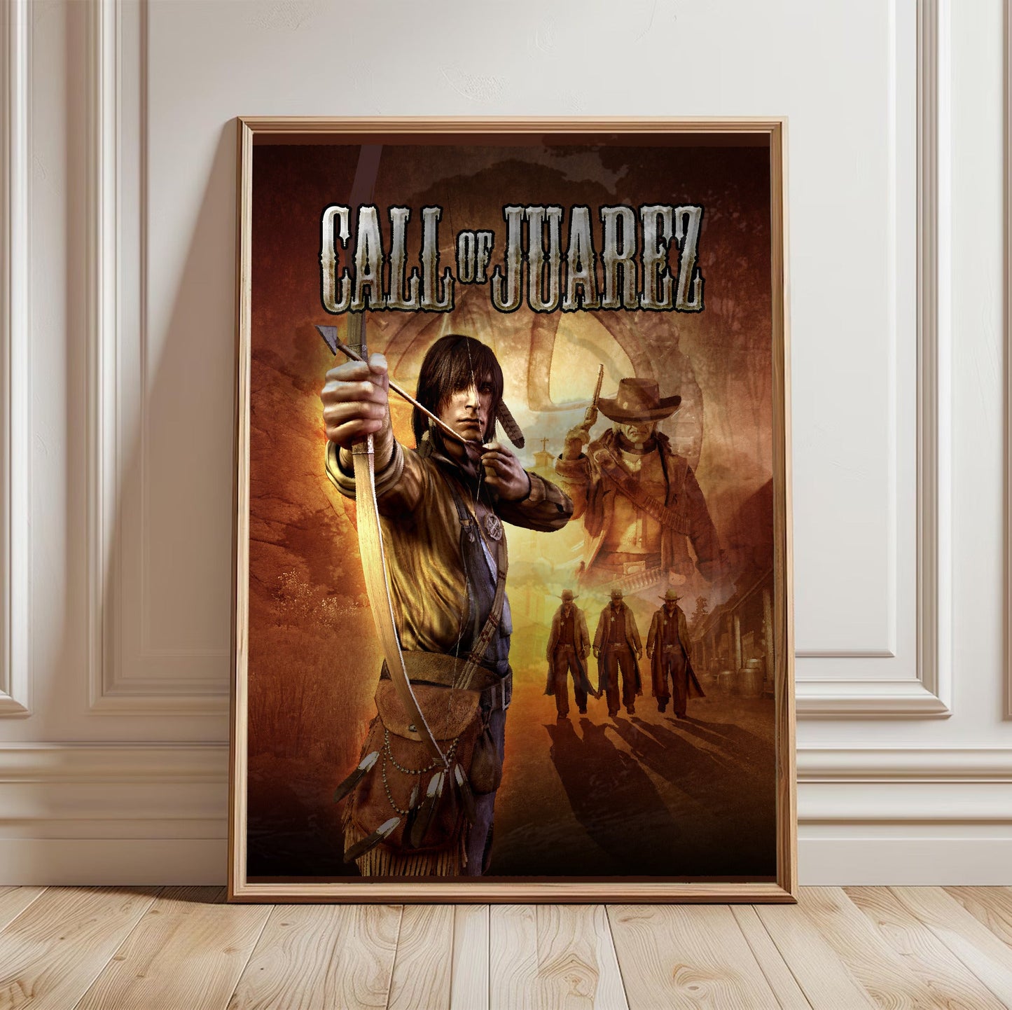Call of Juarez key art with logo in a light oak frame leaning against a white wall