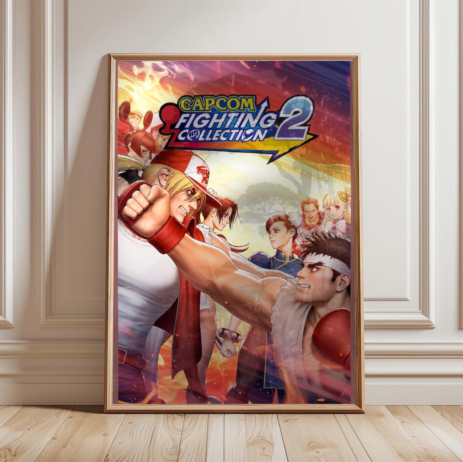 Capcom Fighting Collection 2 key art with logo in a light oak frame leaning against a white wall