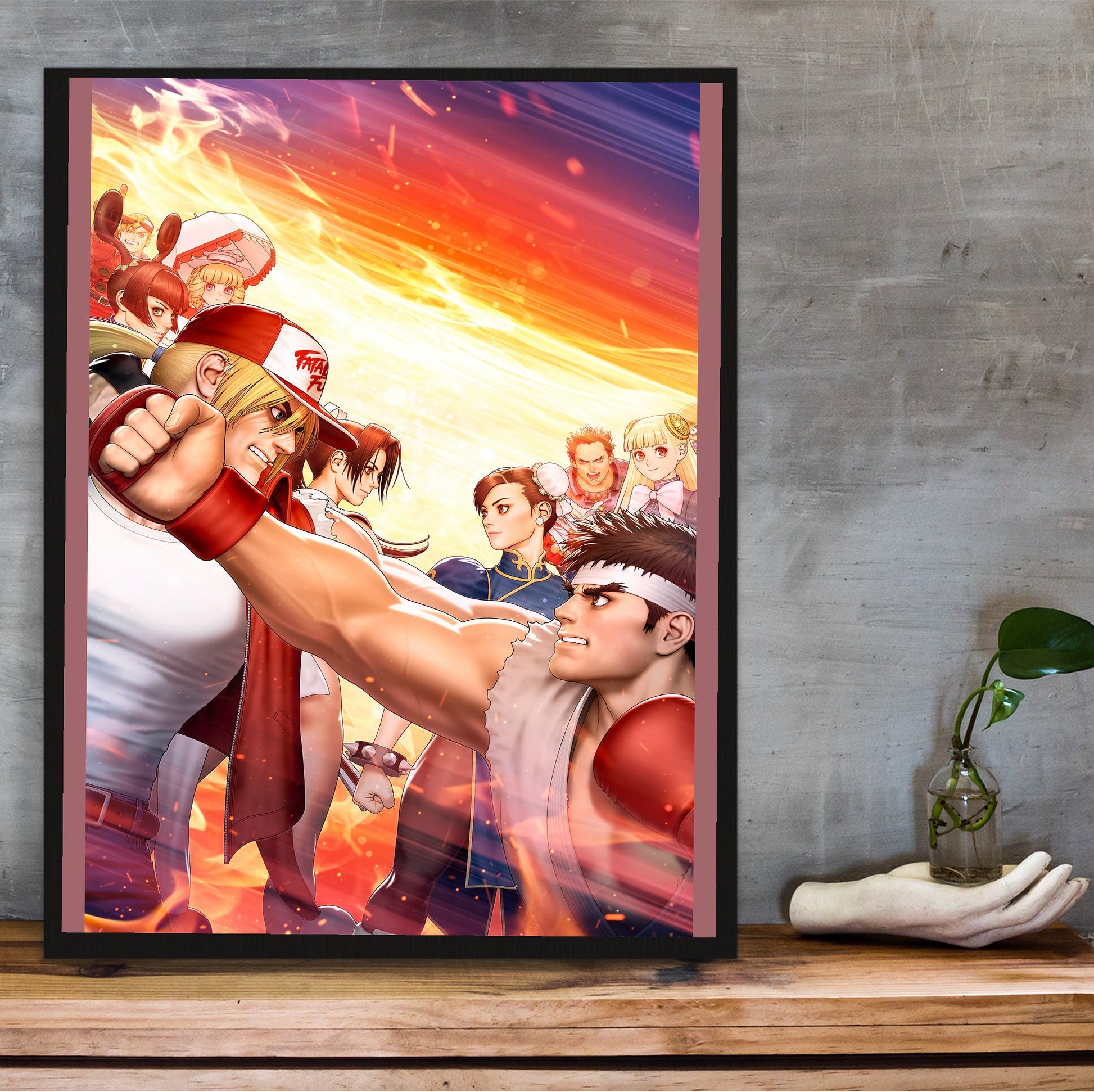 Capcom Fighting Collection 2 key artwork in a black frame on a wooden shelf against concrete