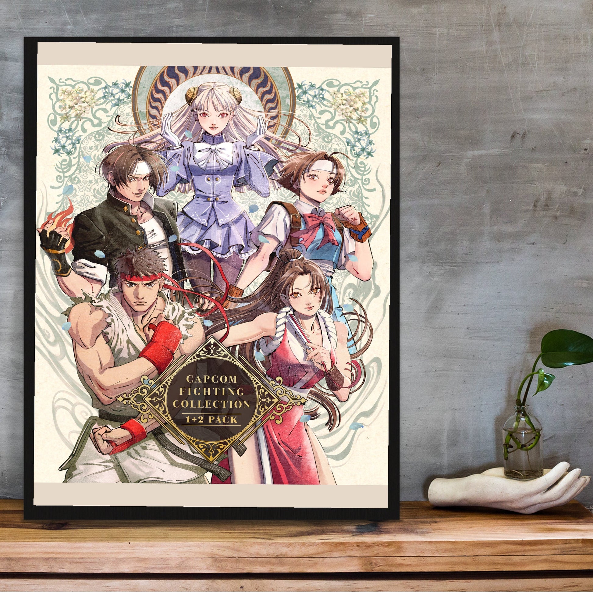 Capcom Fighting Collection 2 pack art in a black frame on a wooden shelf against concrete
