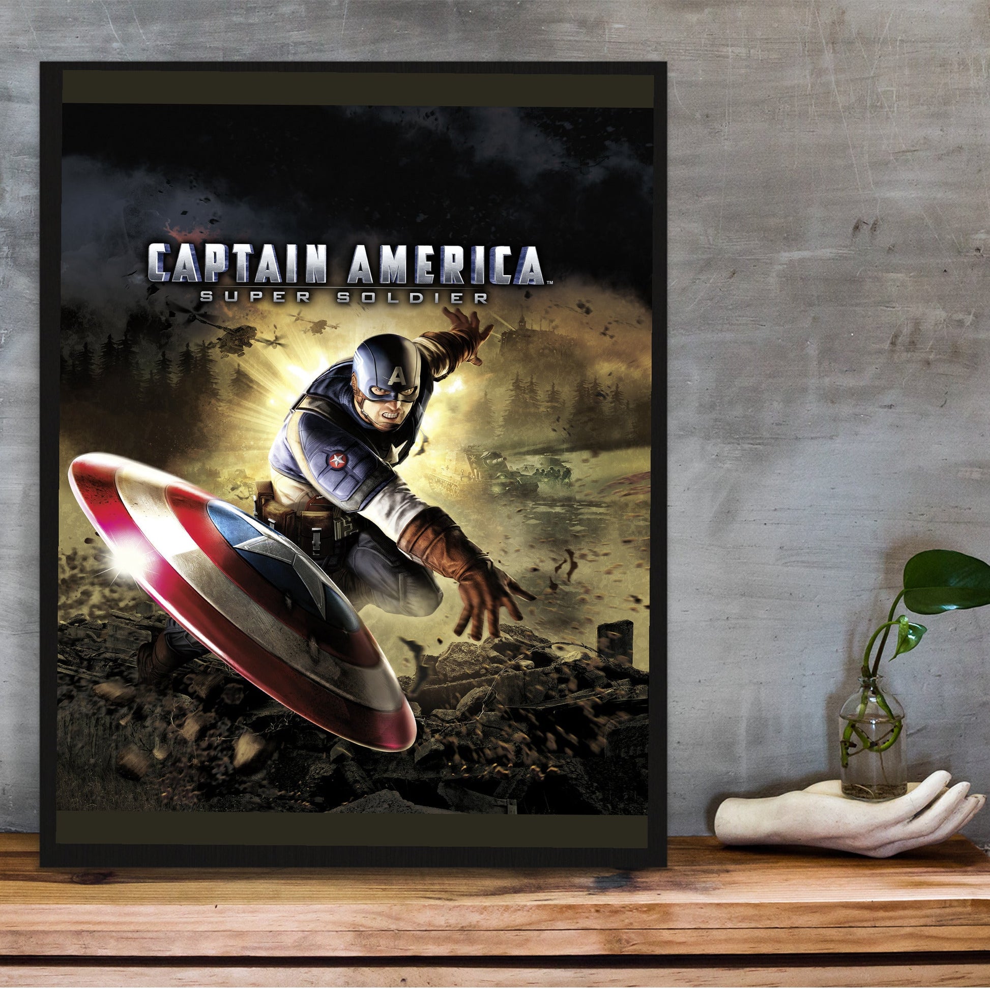 Captain America Super Soldier cover art with logo in a black frame on a wooden shelf against concrete