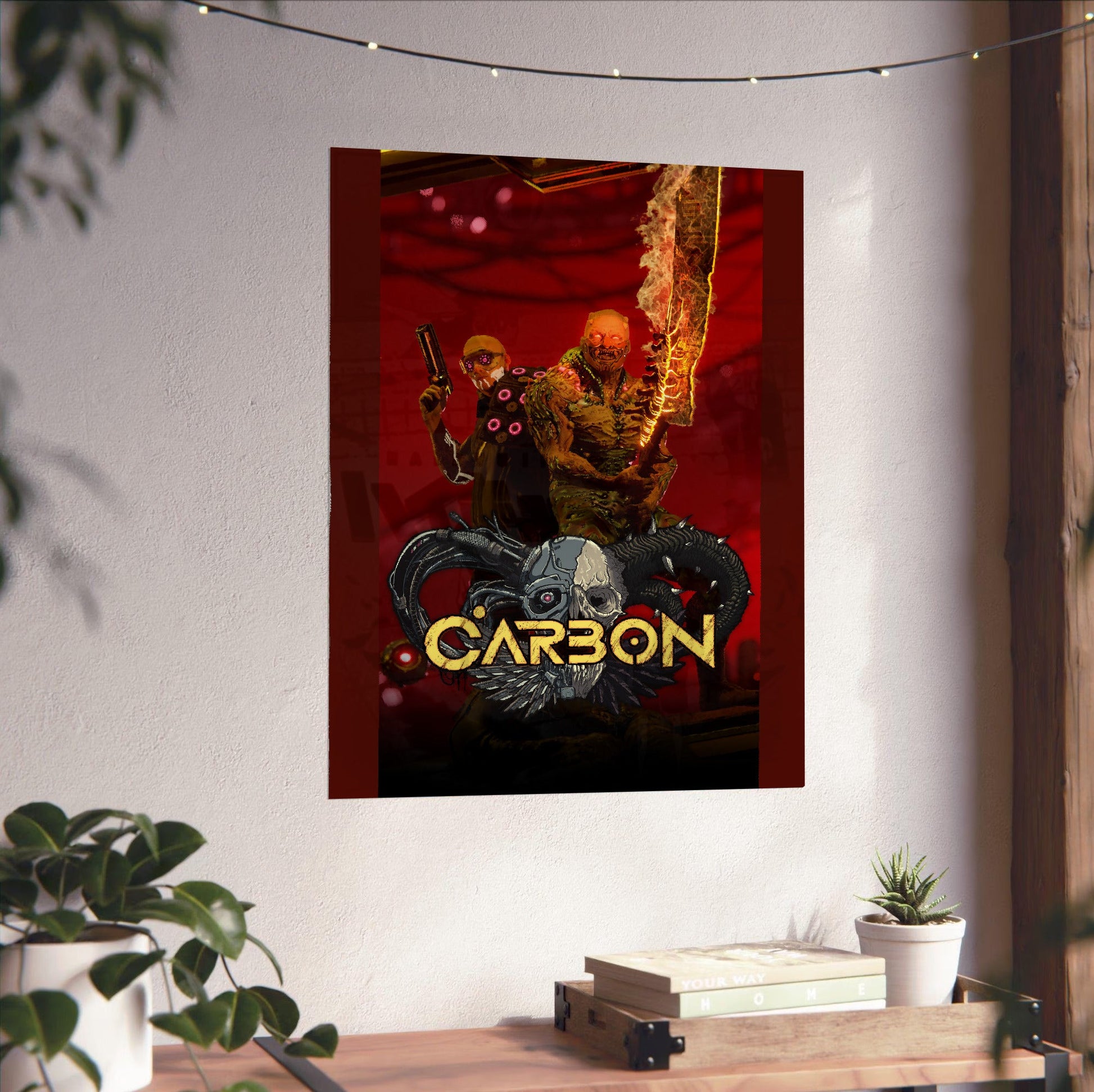 Carbon key art unframed on a white wall above a desk