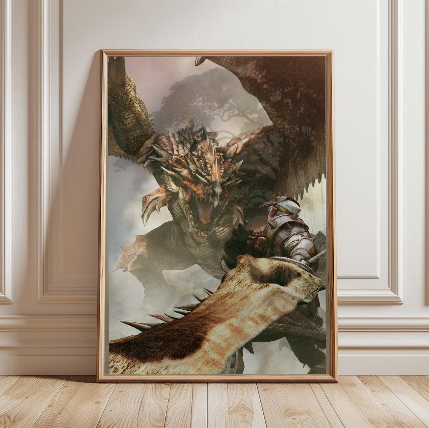 Monster Hunter Freedom cover art in a light oak frame leaning against a white wall