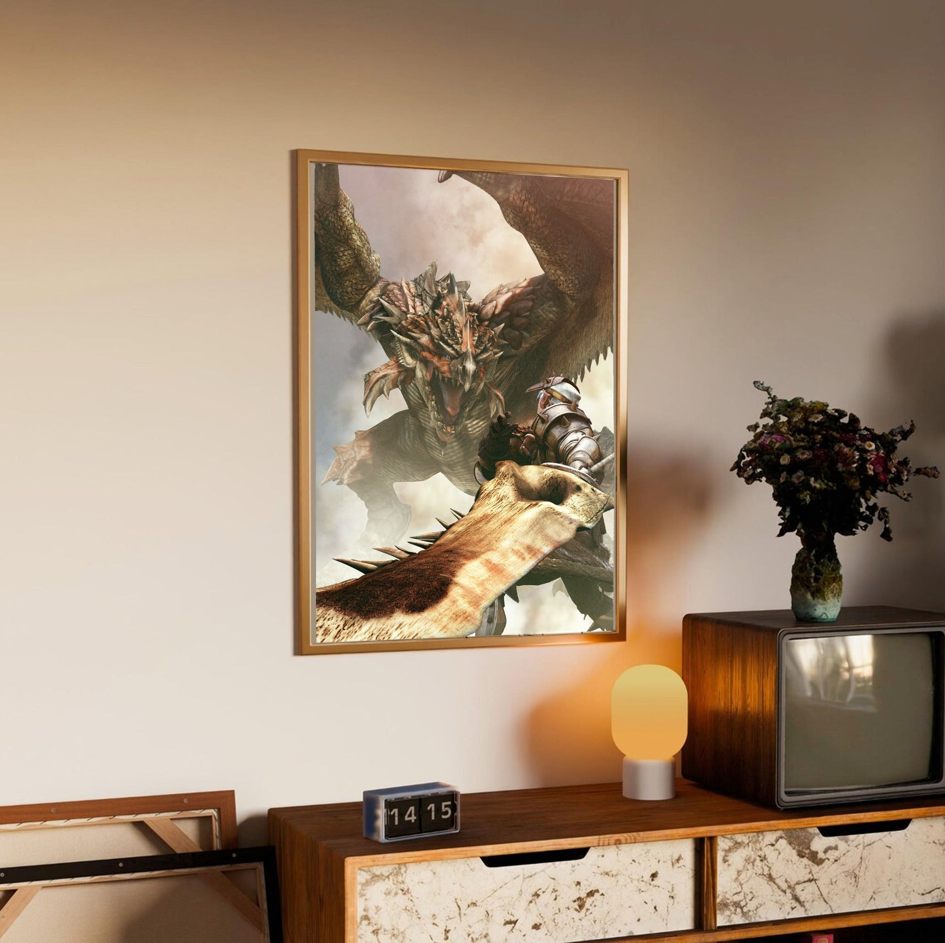 Monster Hunter Freedom cover art in an oak frame above a sideboard