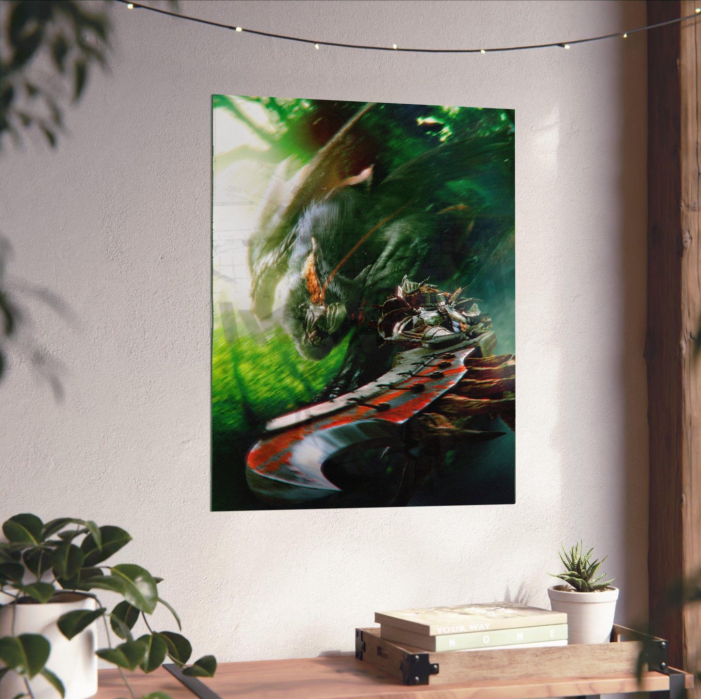 Monster Hunter Freedom Unite key art unframed on a white wall above a desk
