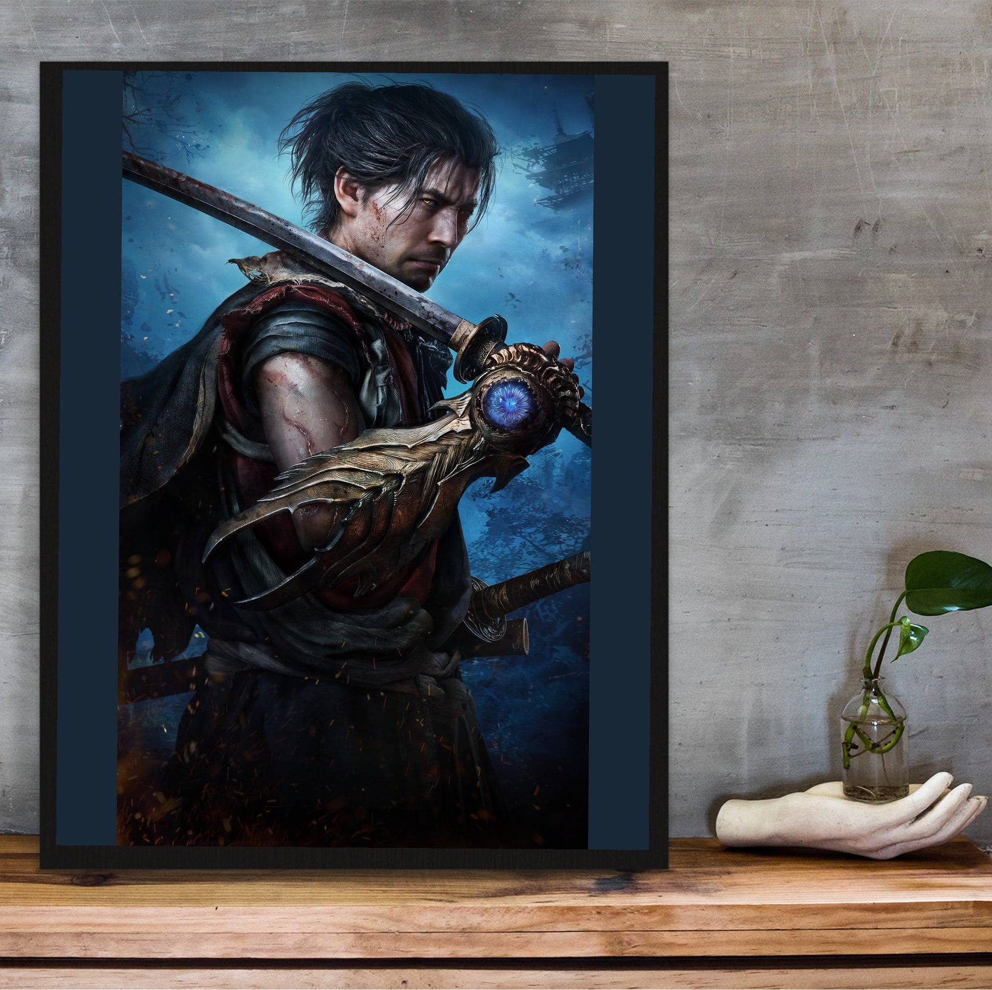 Onimusha Way of the Sword Musashi key art in a black frame on a wooden shelf against concrete