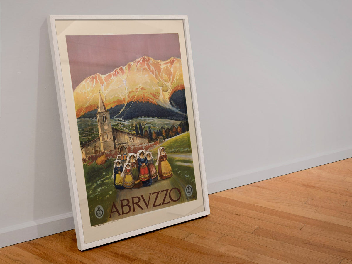 Abruzzo Italy poster in a white frame leaning against a wall