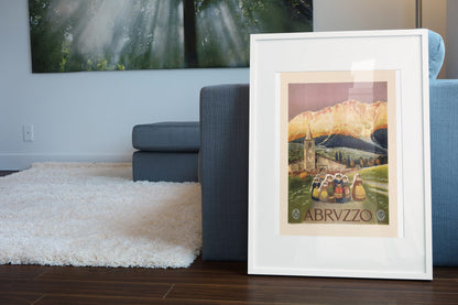 Abruzzo Italy poster leaning beside a blue sofa