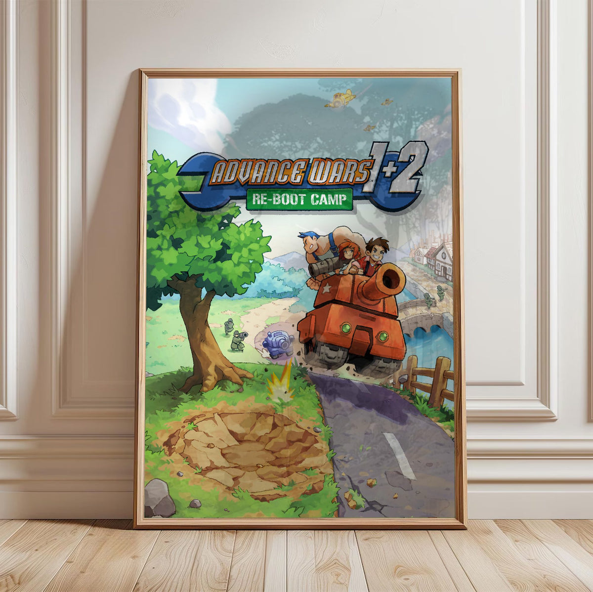 Advance Wars 1+2: Re-Boot Camp Key Art poster in a light oak frame leaning against a white wall
