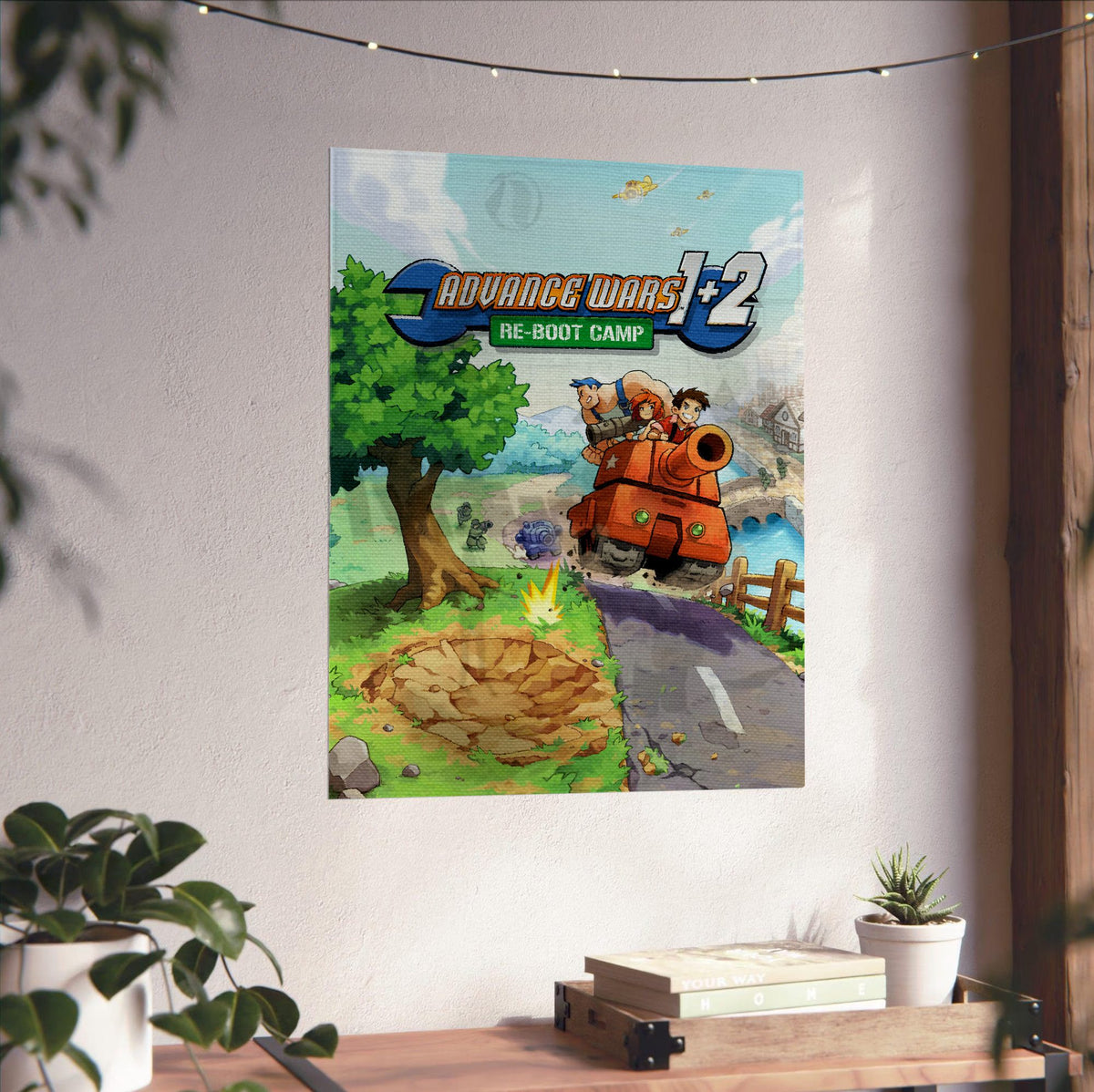 Advance Wars 1+2: Re-Boot Camp Key Art poster unframed on a white wall above a desk