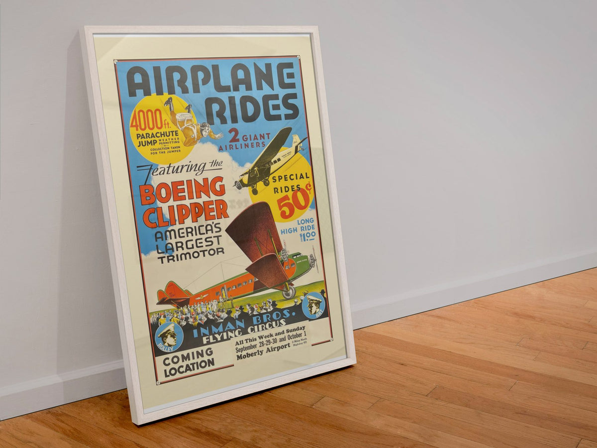 Airplane Rides Barnstorming poster in a white frame leaning against a wall