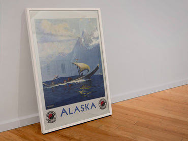 Alaska Northern Pacific poster in a white frame leaning against a wall