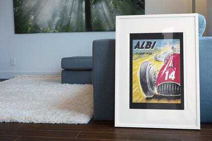 Albi Grand Prix 1952 poster in a white frame leaning beside a blue sofa