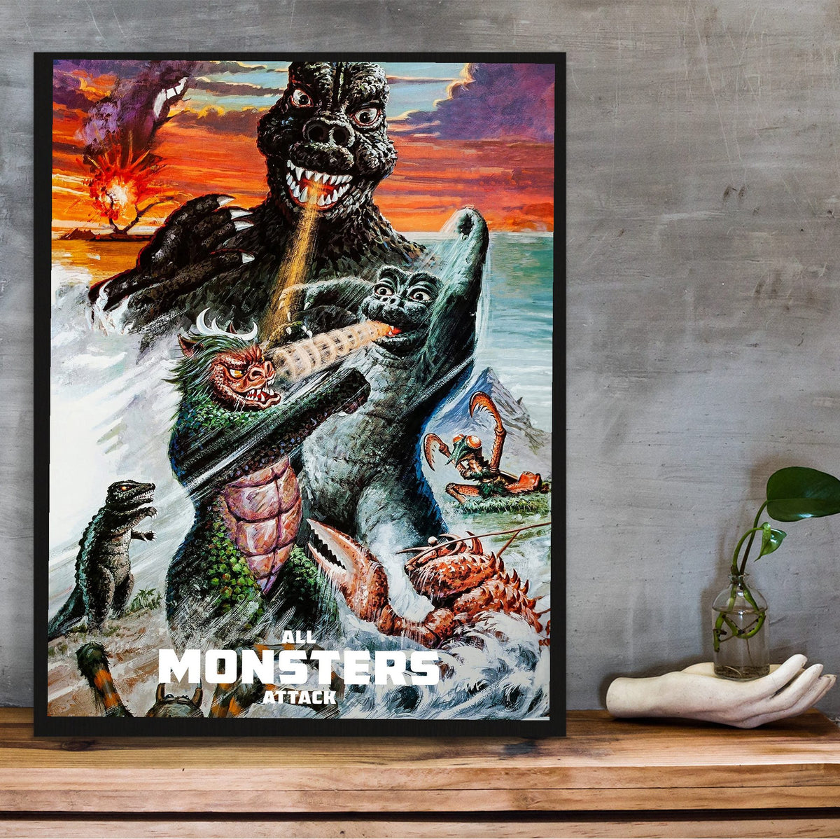 All Monsters Attack (1969) Movie Illustrated Art poster in a black frame on a wooden shelf against concrete