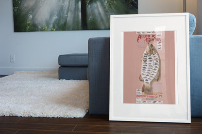 Allen and Ginter American Fish poster leaning beside a blue sofa