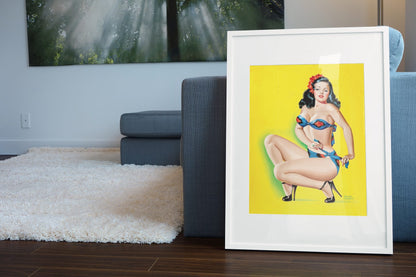 Aloha Blue Bikini poster leaning beside a blue sofa