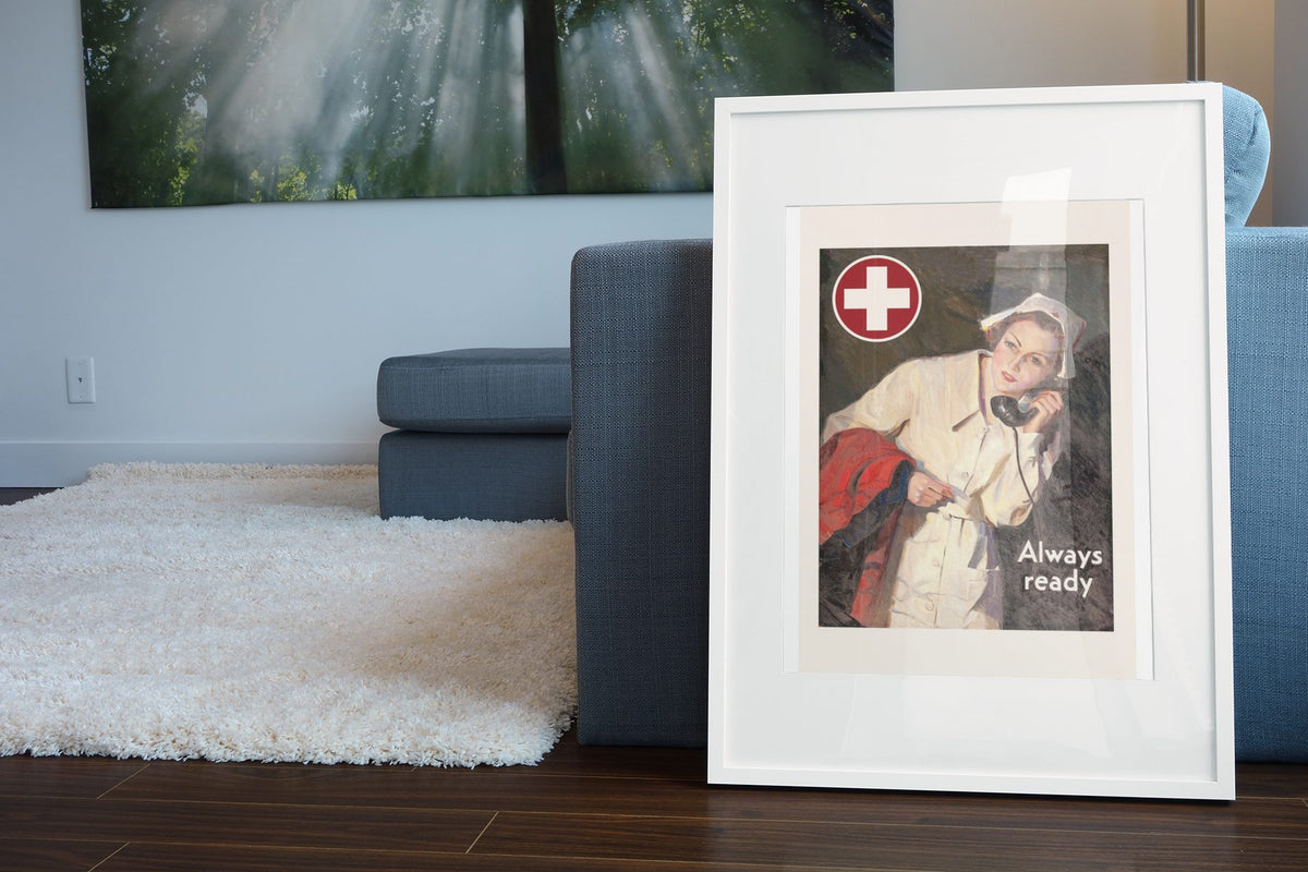 Always Ready Red Cross Nurse poster leaning beside a blue sofa