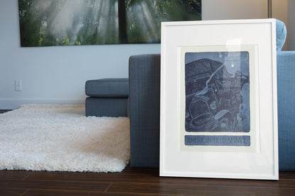 American Field Service poster leaning beside a blue sofa