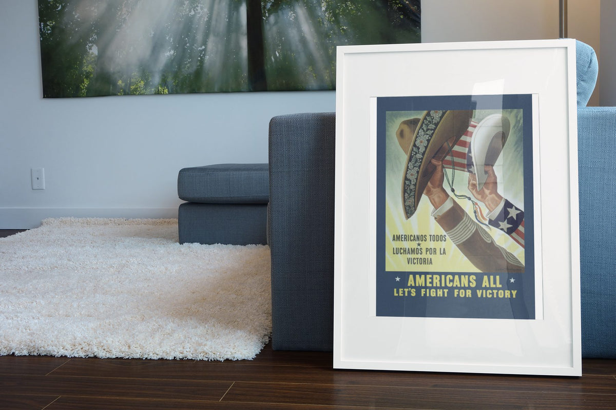 Americans All Lets Fight for Victory poster leaning beside a blue sofa