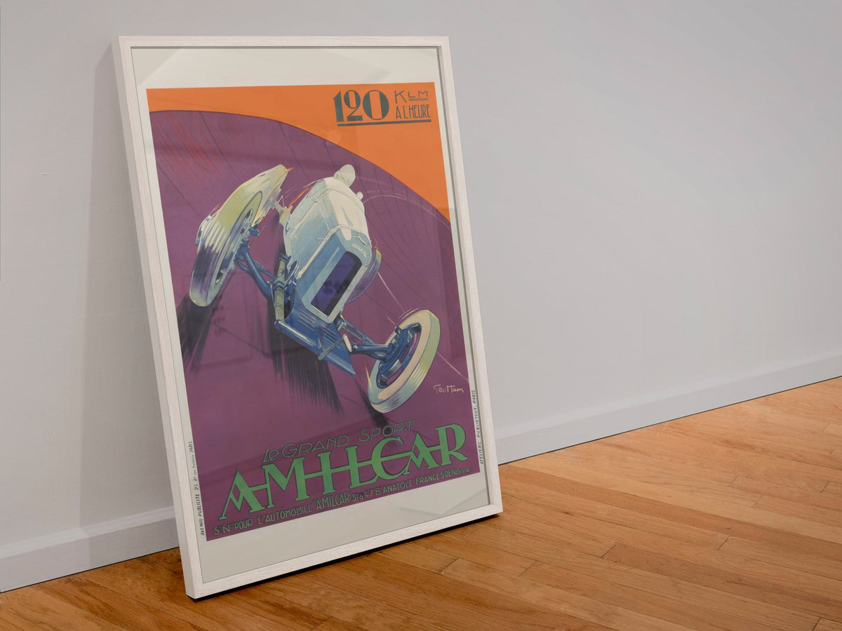 Amilcar Grand Sport poster in a white frame leaning against a wall