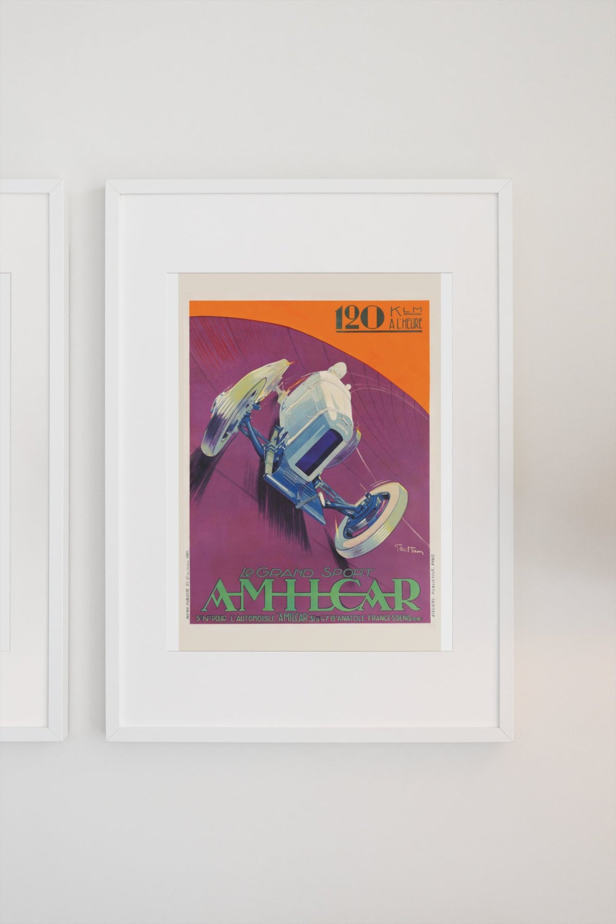 Amilcar Grand Sport poster in a white frame on a light wall