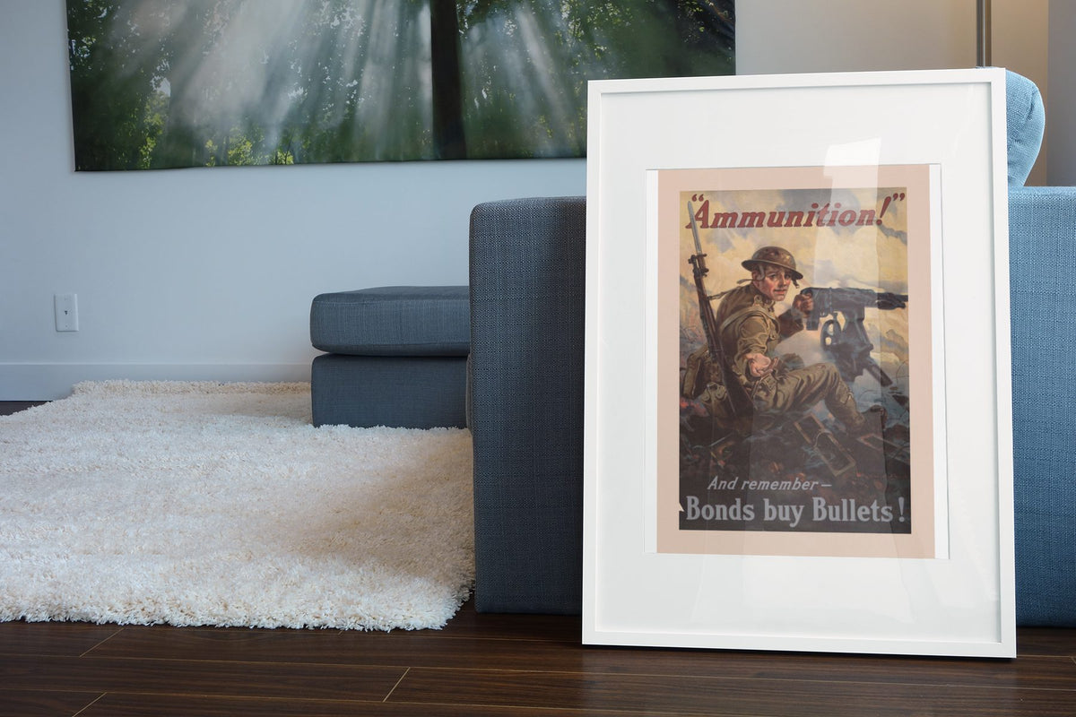 Ammunition Bonds Buy Bullets poster leaning beside a blue sofa