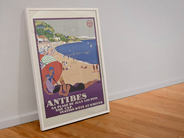 Antibes Juan les Pins poster in a white frame leaning against a wall