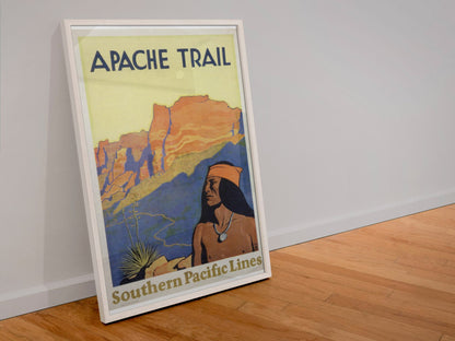 Apache Trail Southern Pacific poster in a white frame leaning against a wall