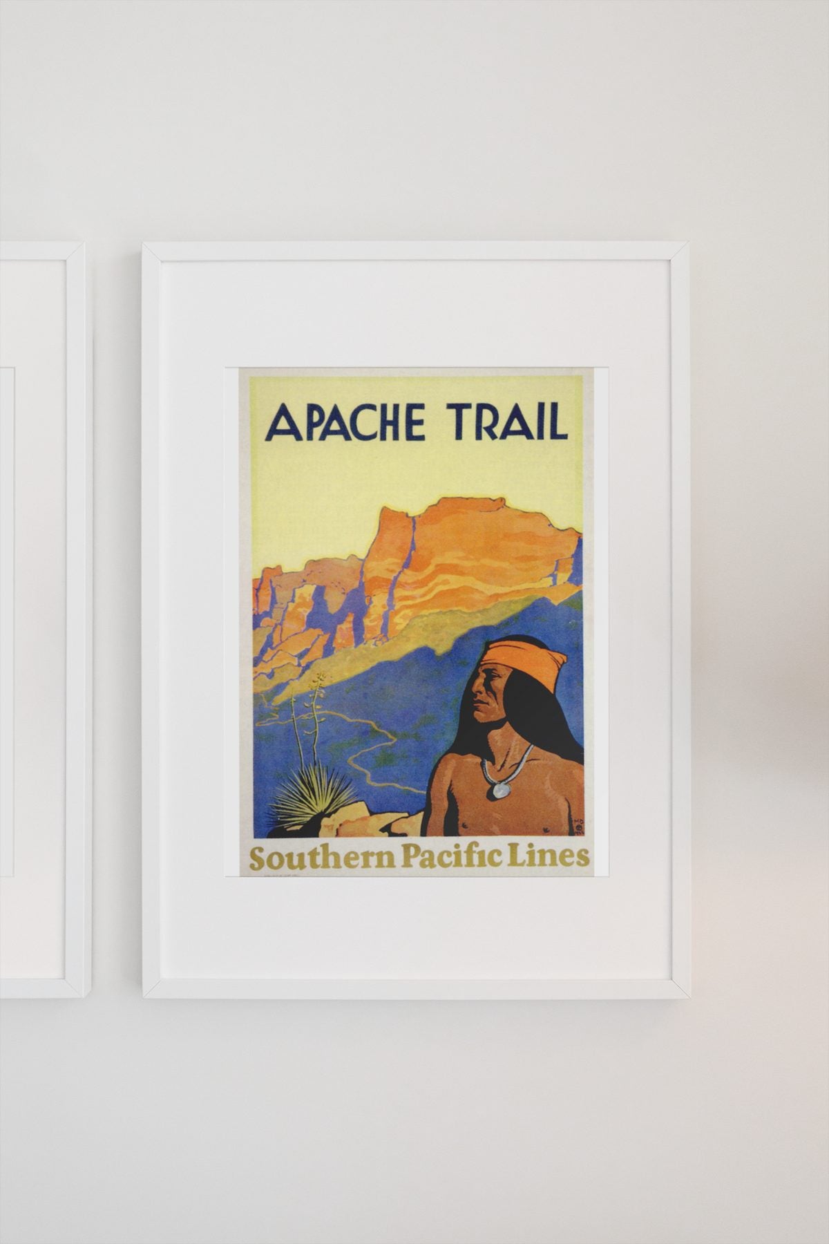 Apache Trail Southern Pacific poster on a light wall