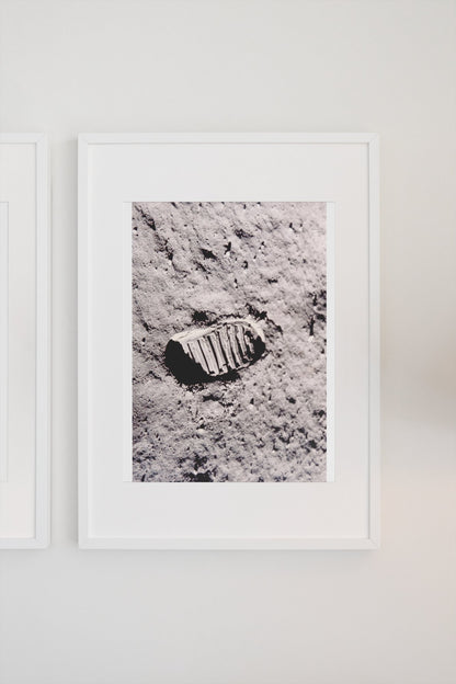 Apollo 11 bootprint on the Moon poster in a white frame on a light wall