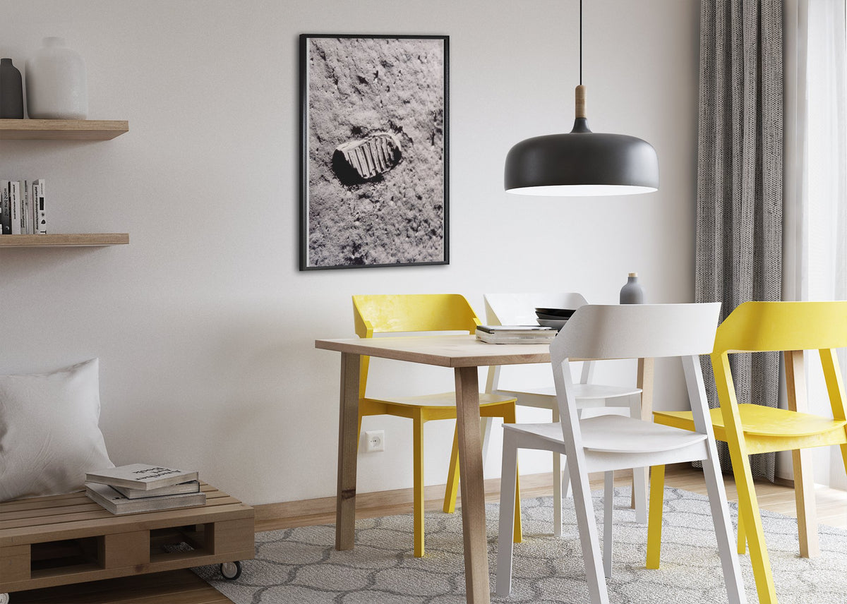 Apollo 11 bootprint on the Moon poster framed above a dining table