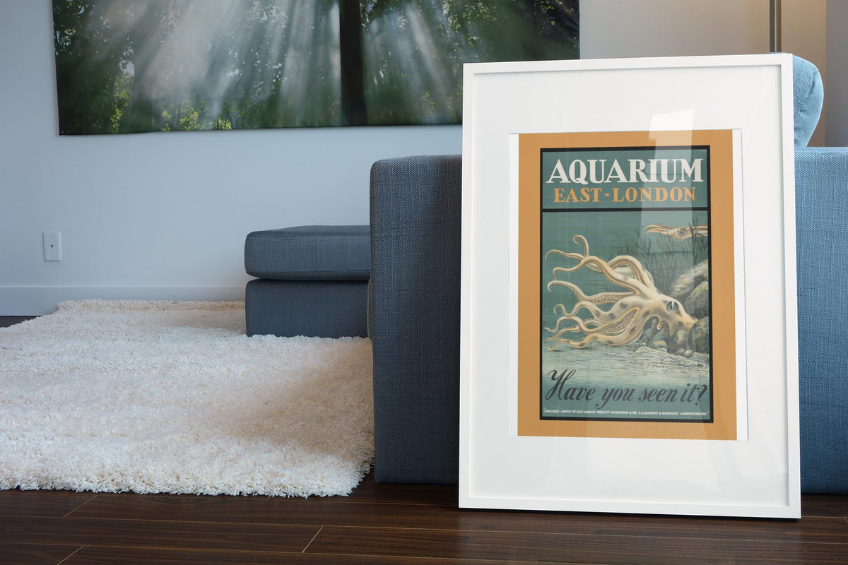 Aquarium East London Octopus poster leaning beside a blue sofa