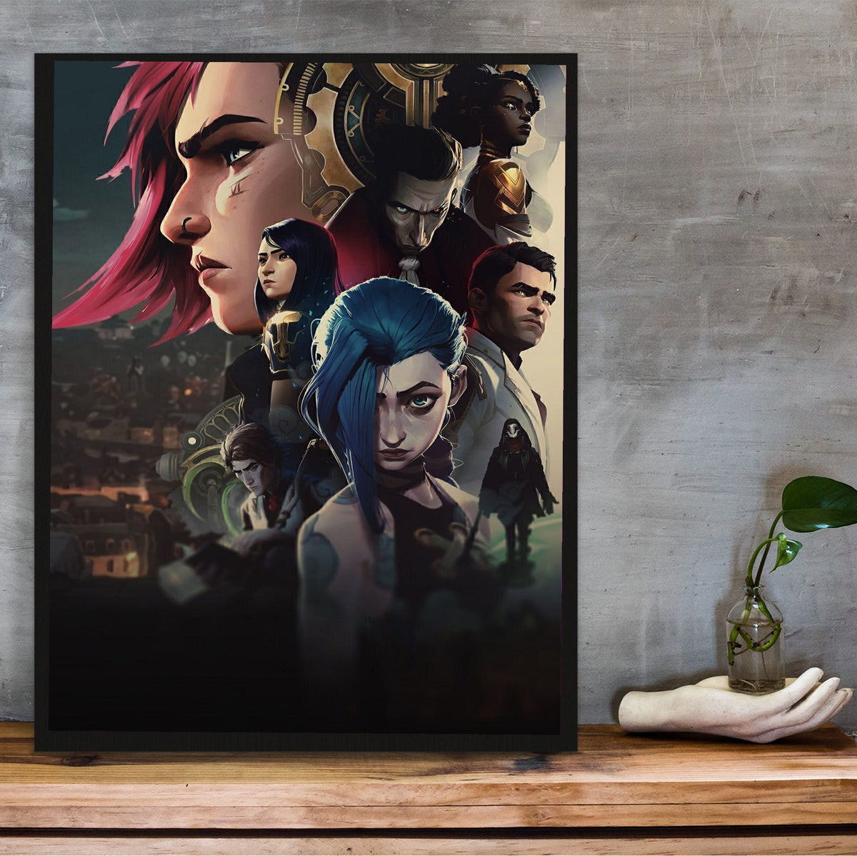 Arcane Character Collage Art poster in a black frame on a wooden shelf against concrete