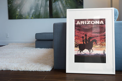 Arizona Desert Sunset poster leaning beside a blue sofa