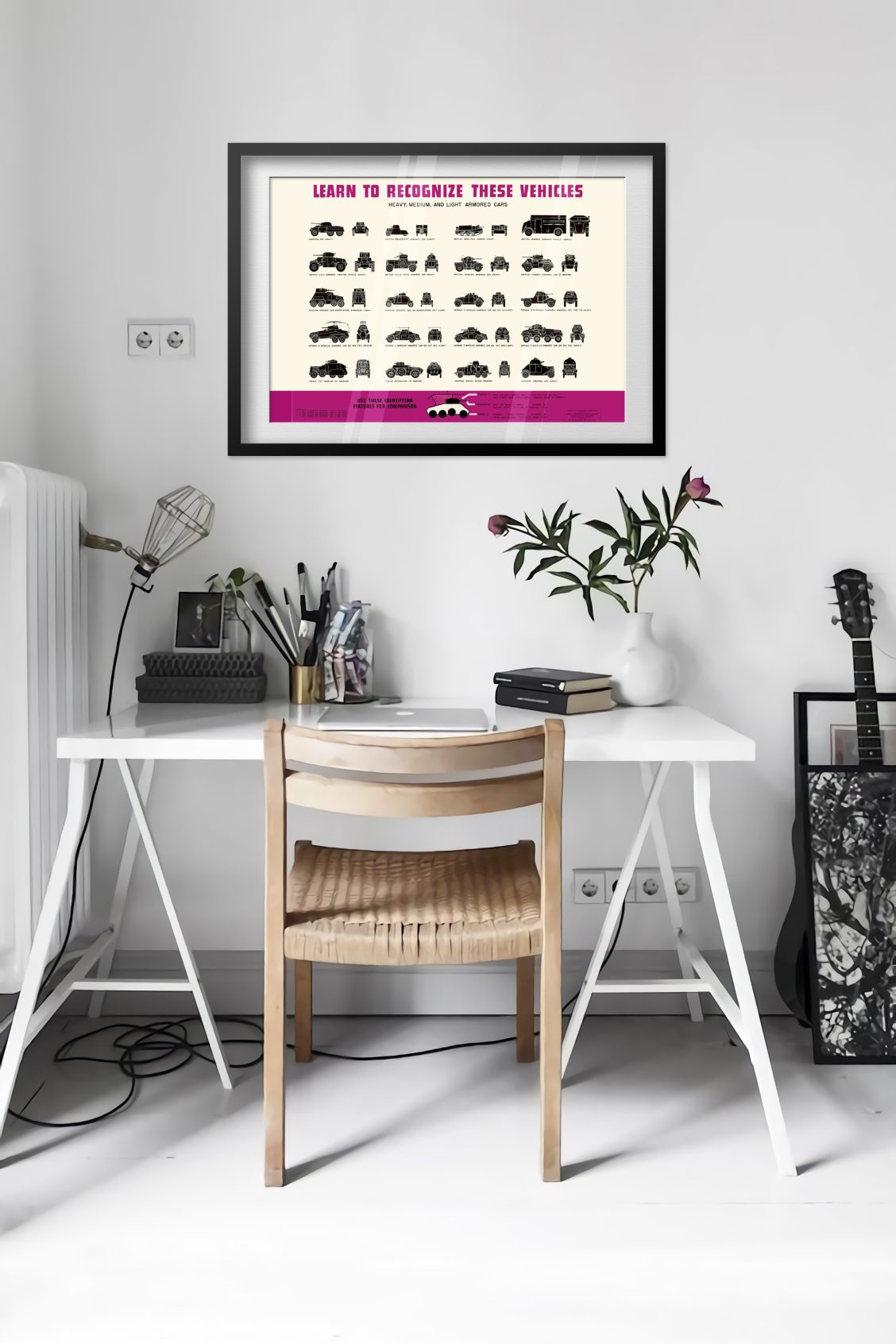 Armored Car Recognition Chart poster framed above a desk in a bright white room