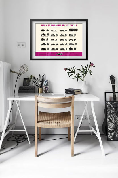Armored Car Recognition Chart poster framed above a desk in a bright white room