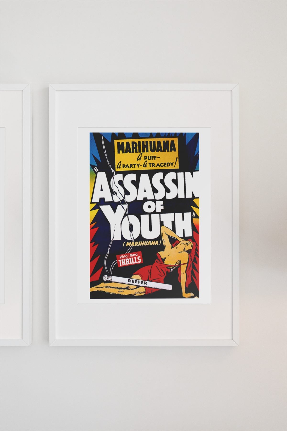 Assassin of Youth poster on a light wall