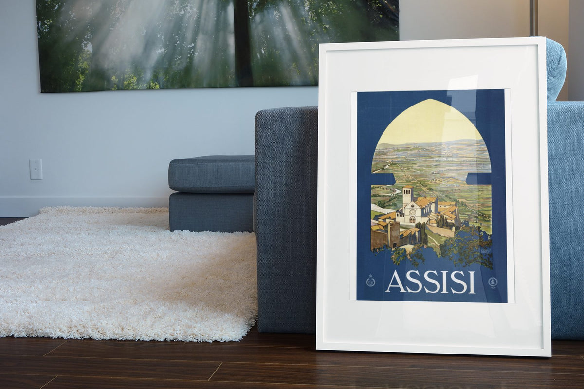 Assisi poster leaning beside a blue sofa