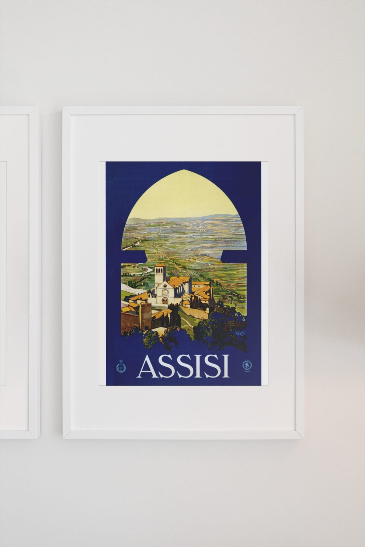 Assisi poster on a light wall