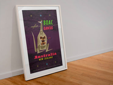 Australia New Zealand BOAC Qantas poster in a white frame leaning against a wall