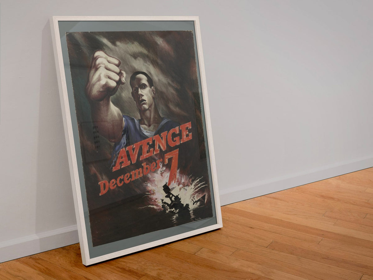 Avenge December 7 poster in a white frame leaning against a wall