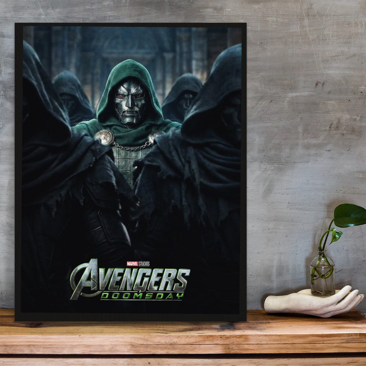 Avengers: Doomsday (2026) Movie Comic-Style Ensemble Art poster in a black frame on a wooden shelf against concrete