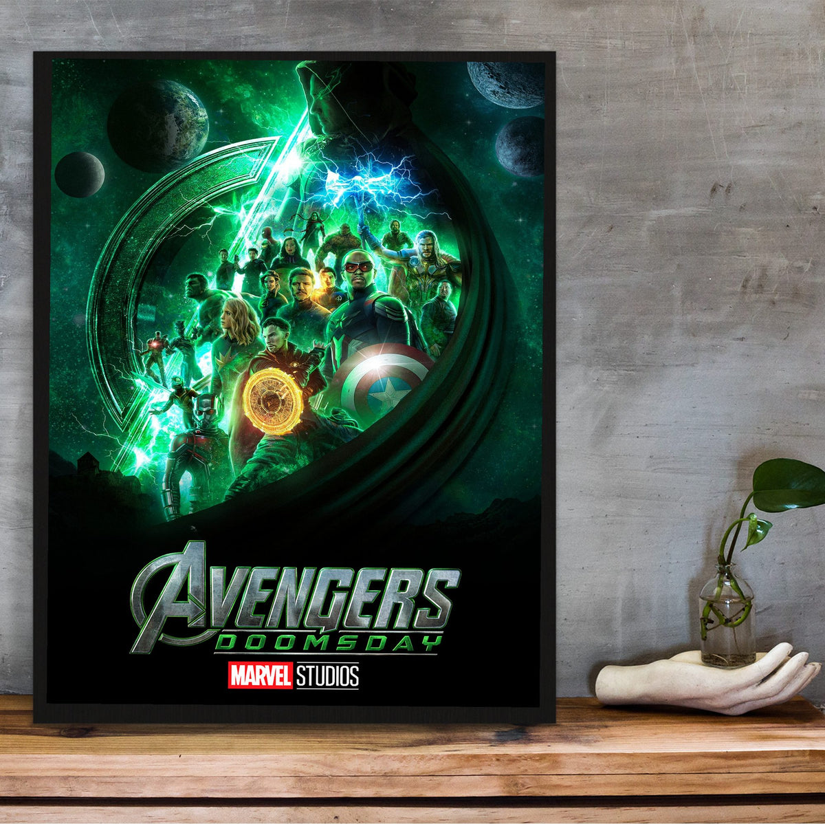 Avengers: Doomsday (2026) Movie Doctor Doom Teaser Art poster in a black frame on a wooden shelf against concrete