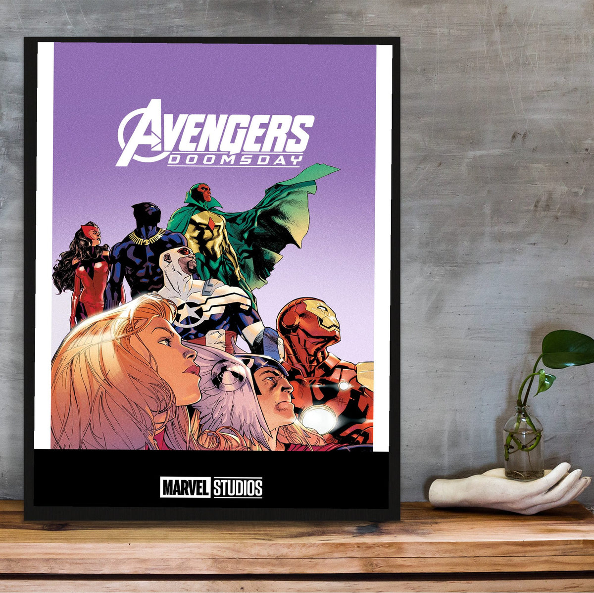 Avengers: Doomsday (2026) Movie Illustrated Purple Art poster in a black frame on a wooden shelf against concrete