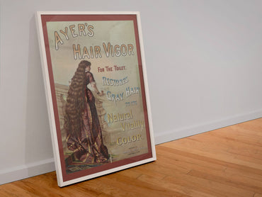 Ayers Hair Vigor poster in a white frame leaning against a wall